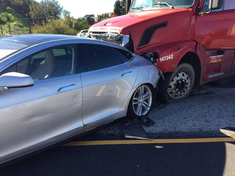 Tesla Model S Gets Rear-Ended by a Semi-Truck, Driver Walks Away