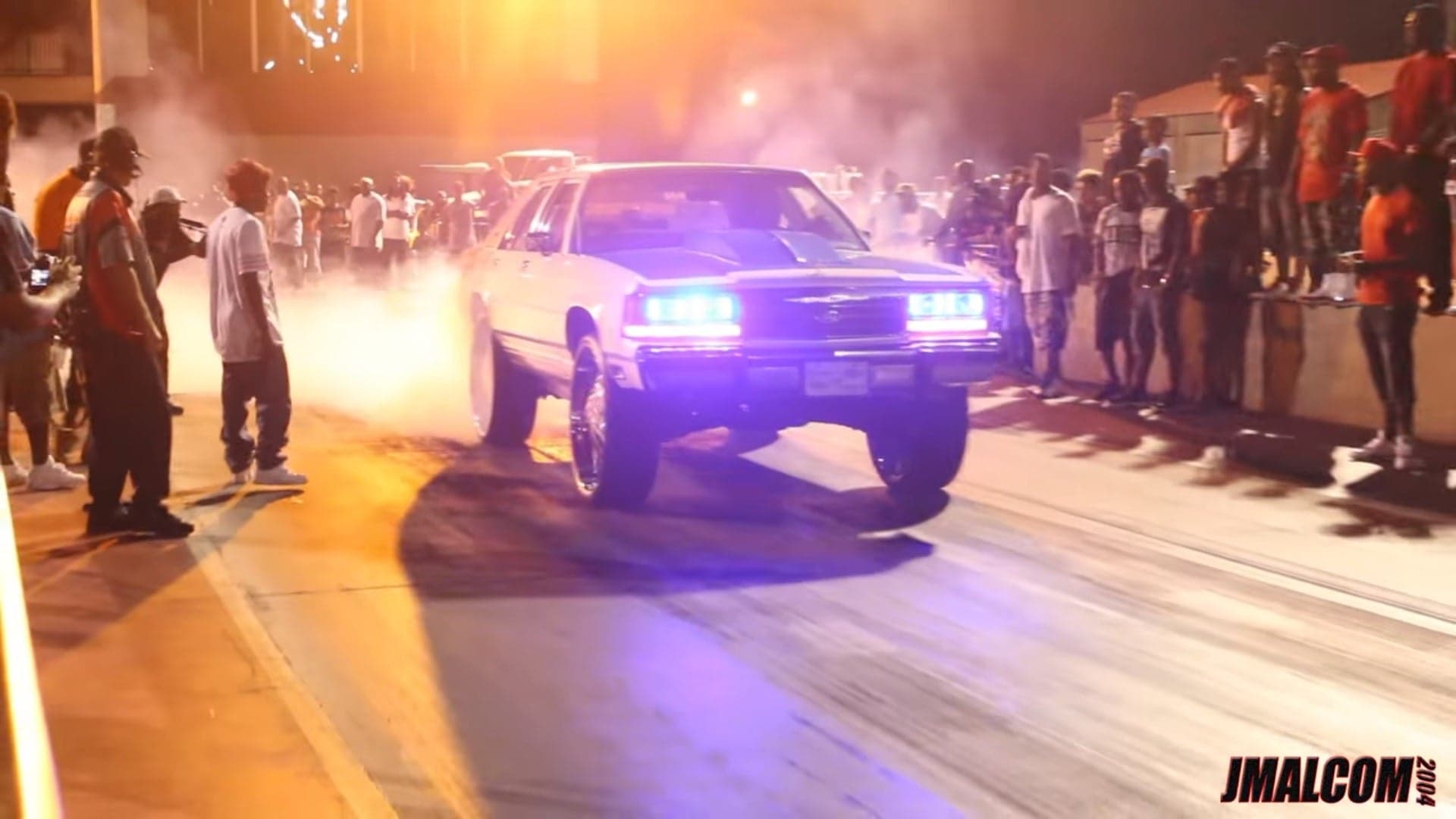 Watch a Lifted Ford Crown Victoria LTD on 30-Inch Rims Hit the Drag Strip