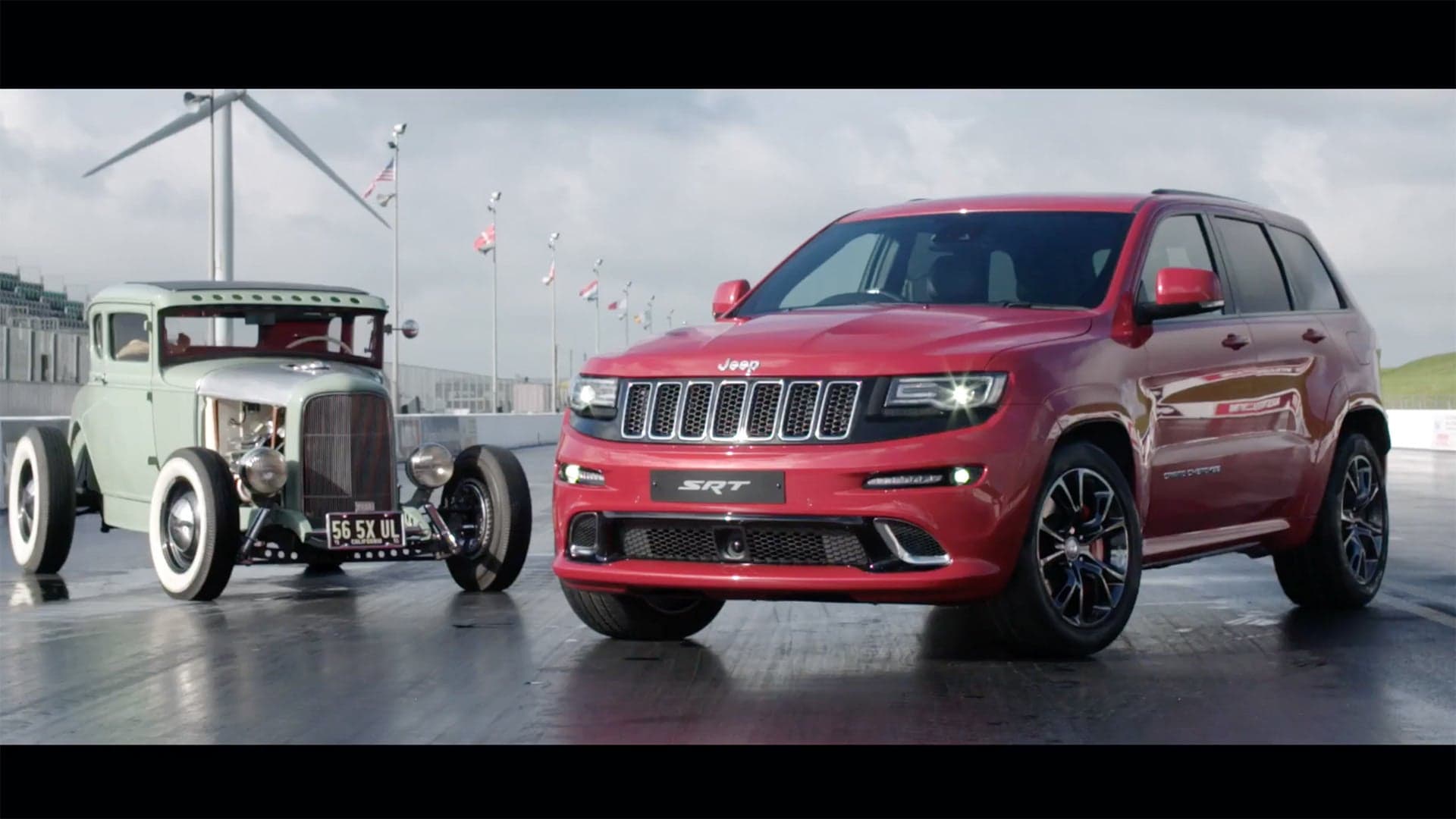 Watch This Jeep Grand Cherokee SRT Drag Race a Hemi-Powered Hot Rod