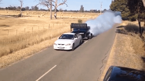 Australian Ute Does a Burnout On a Trailer Towed by Another Ute