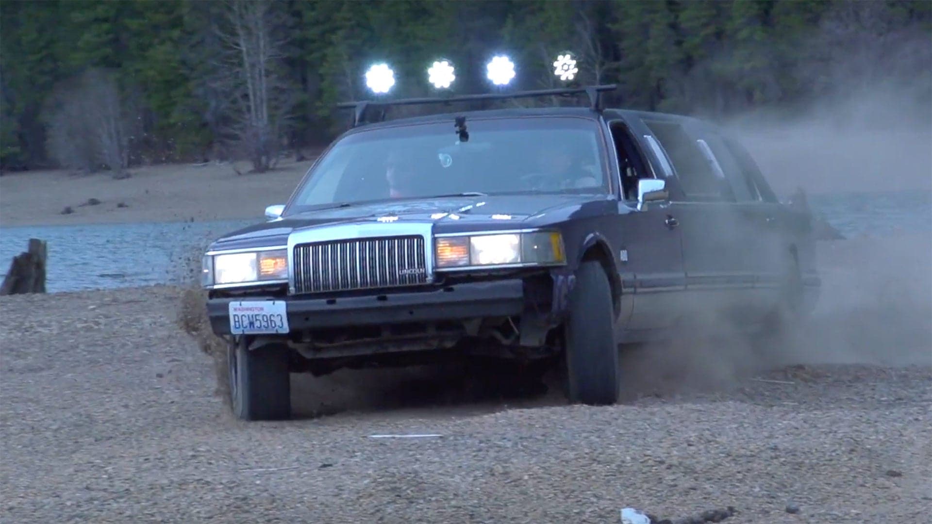 Watch This Off-Road Lincoln Town Car Limousine Blast Around in the Dirt