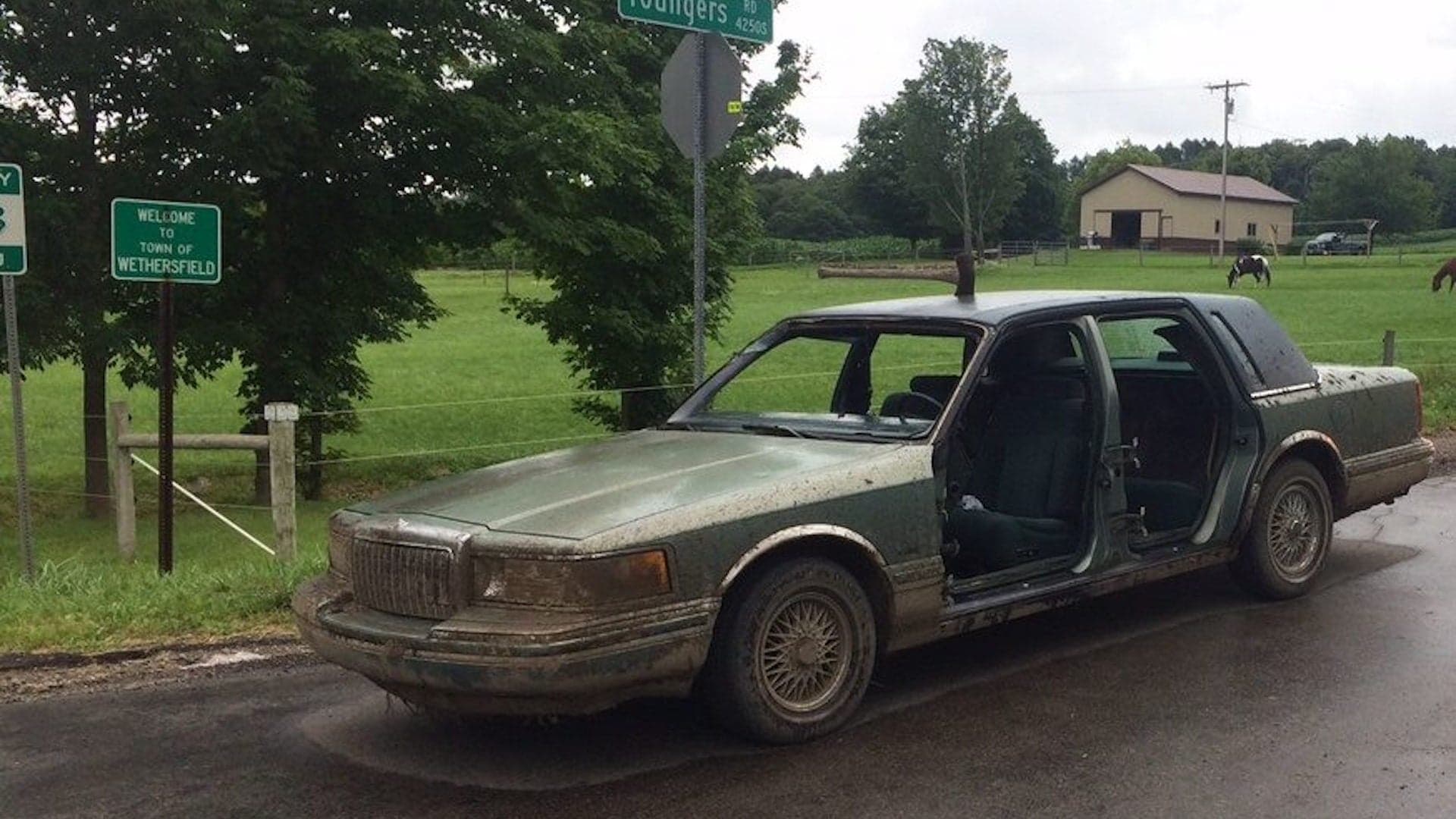 New York Man Arrested in Apocalyptic-Looking Lincoln Town Car With an Ax in Roof