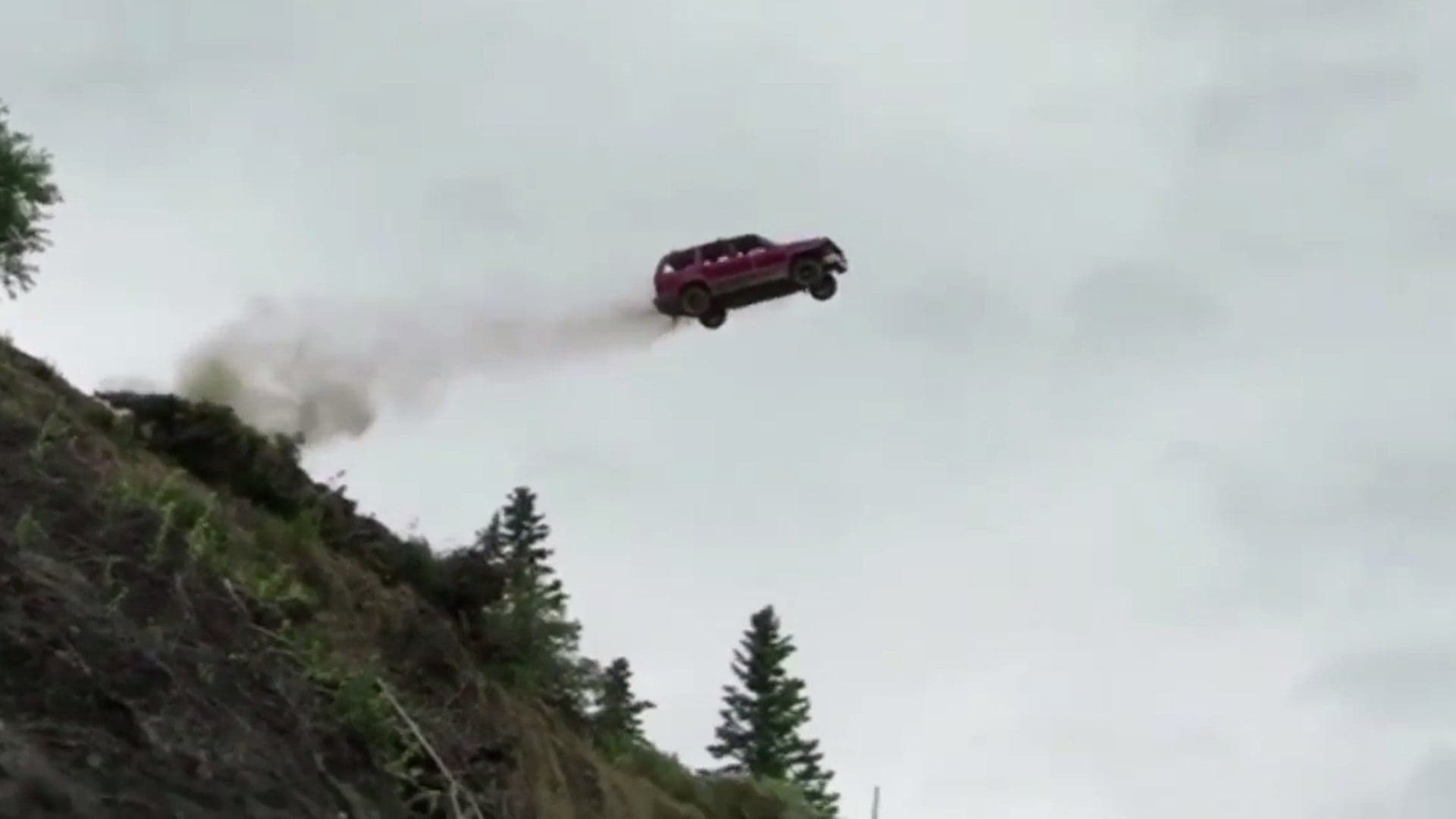 Watch a Bunch of Beater Cars Go Flying Off a 300-Foot Cliff in Alaska