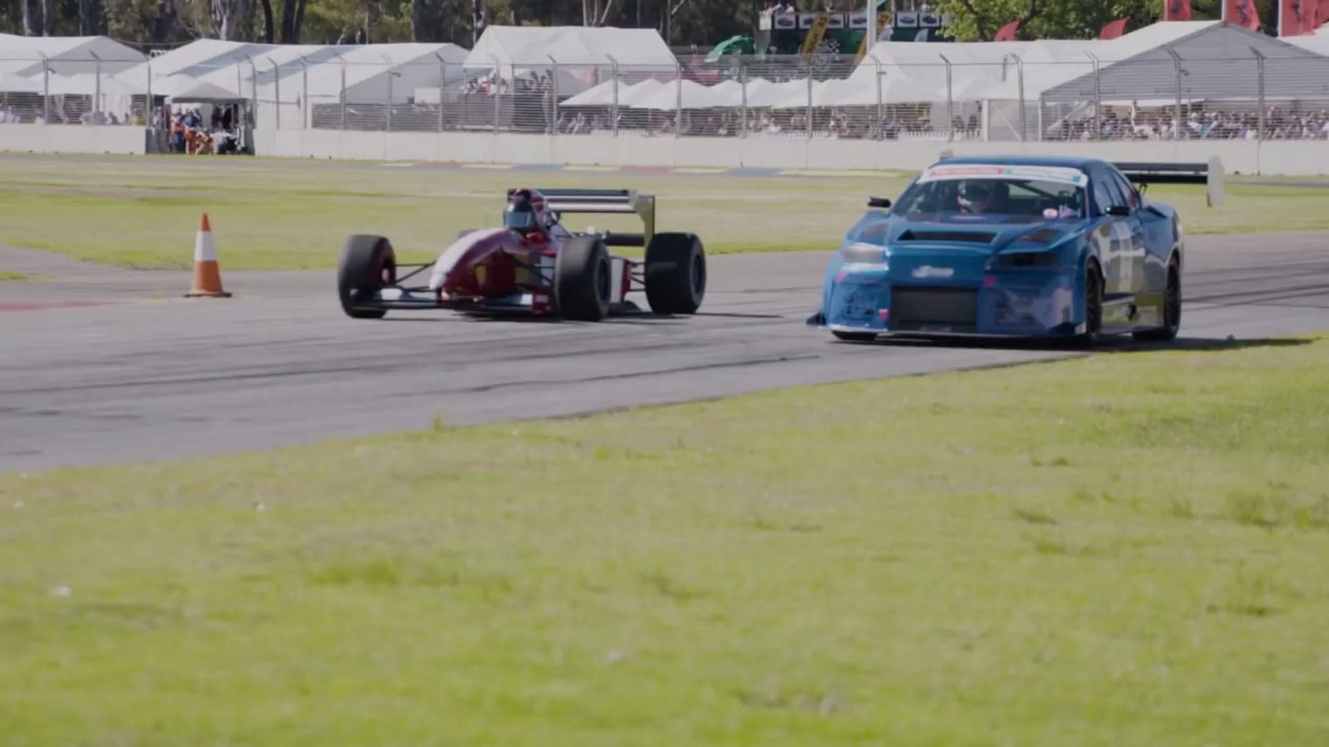 Watch a Formula 1 Car Roll Race an R34 Nissan Skyline GT-R
