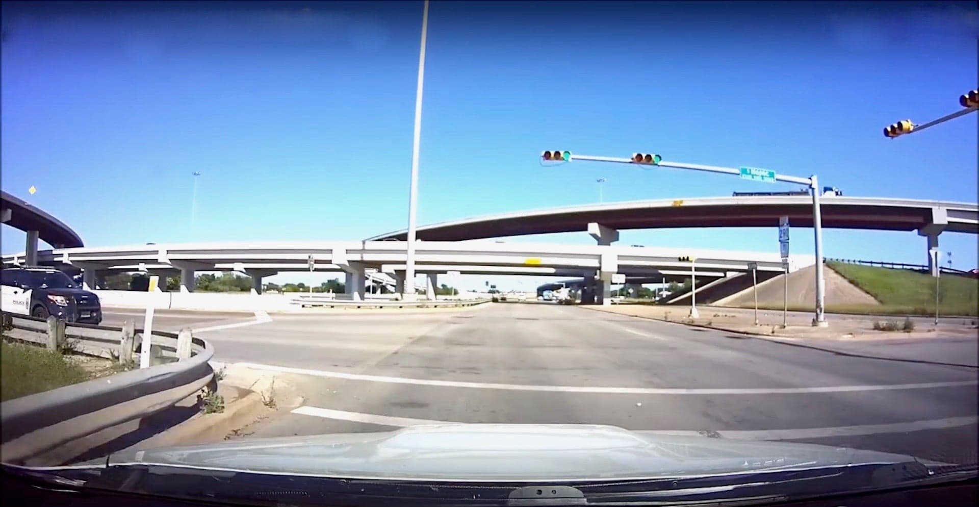 Watch a Distracted Cop Run a Red Light and Narrowly Miss a Subaru