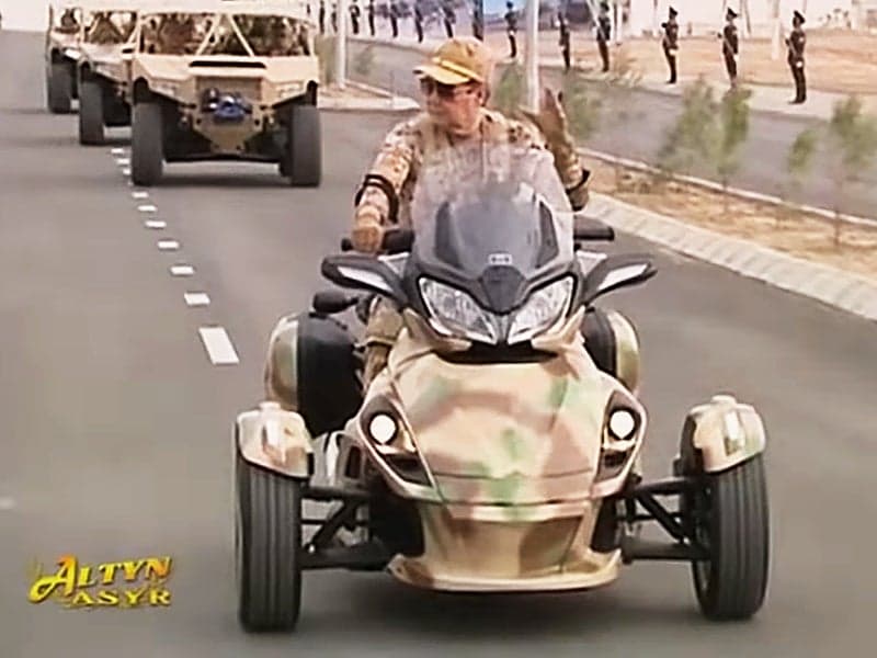 Turkmenistan’s Trike-Riding President Can’t Miss In This Horribly Awesome Propaganda Video