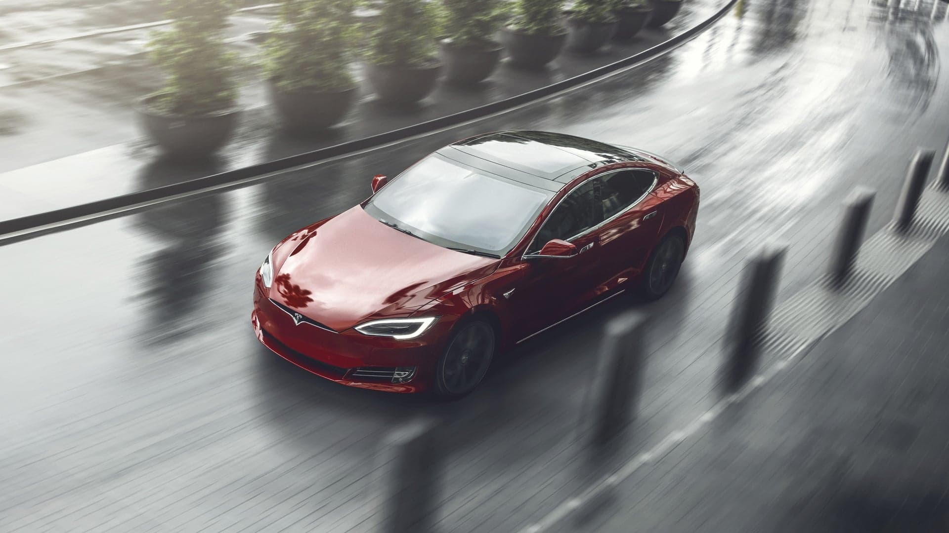 Woman Steals Tesla, Promptly Runs Out of Range and Gets Arrested