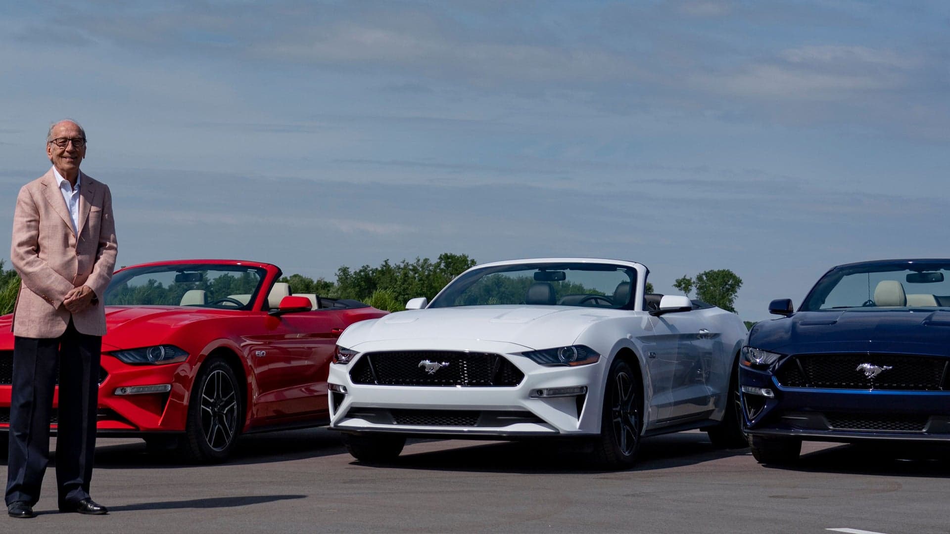 80-Year-Old Car Enthusiast Gifts Red, White, and Blue Ford Mustangs to Kids