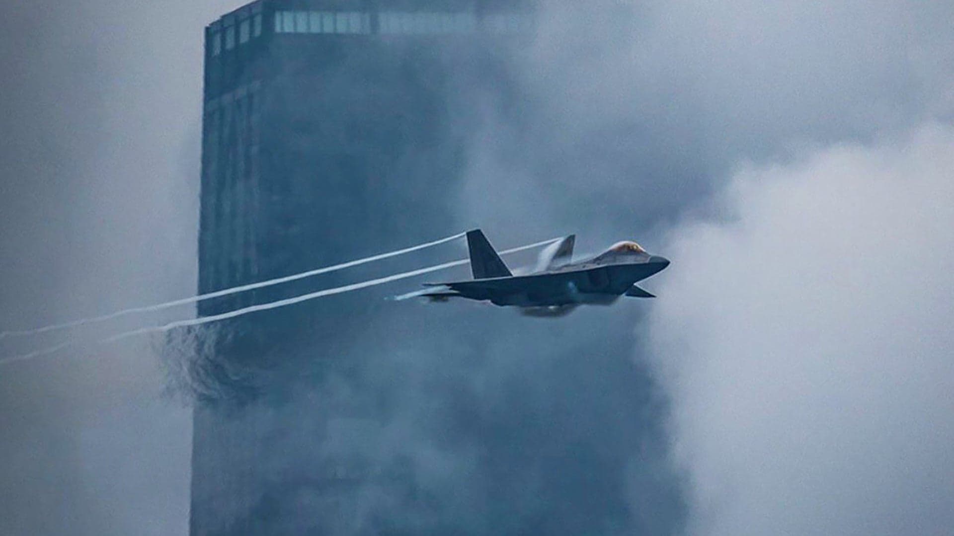 You Have To See The Rest Of This Shot Of An F-22 Tearing Across A Stormy Chicago Skyline