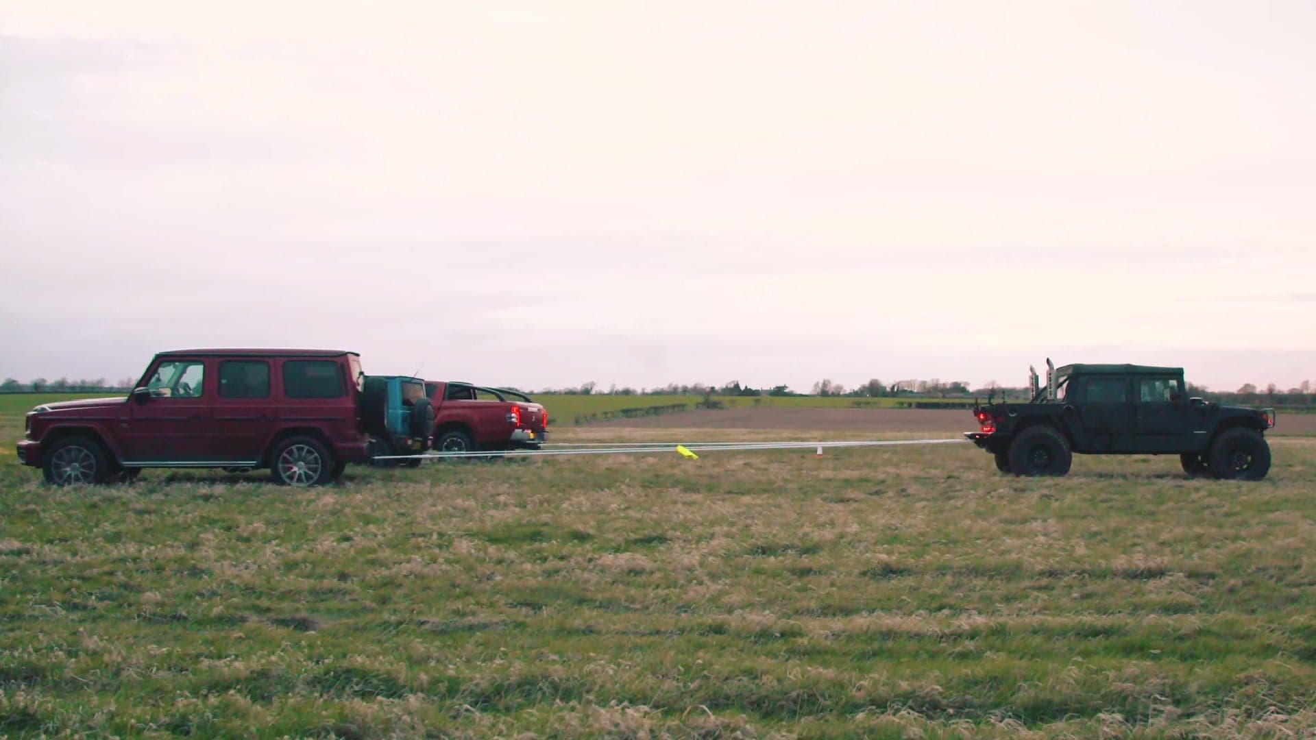 There’s No Match for a Brutish Hummer in This Three-on-One Tug of War