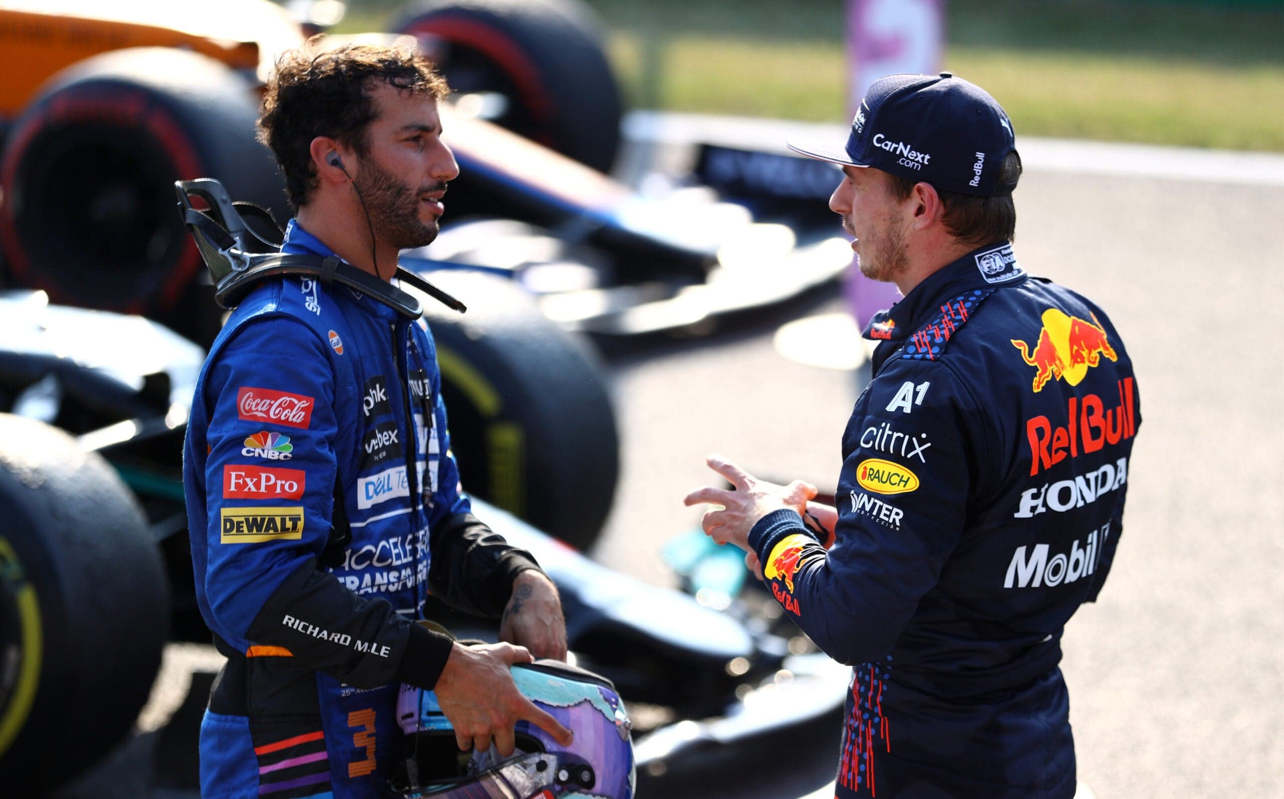 Daniel Ricciardo speaking to Max Verstappen after taking his and McLaren's first win in a long time in Monza