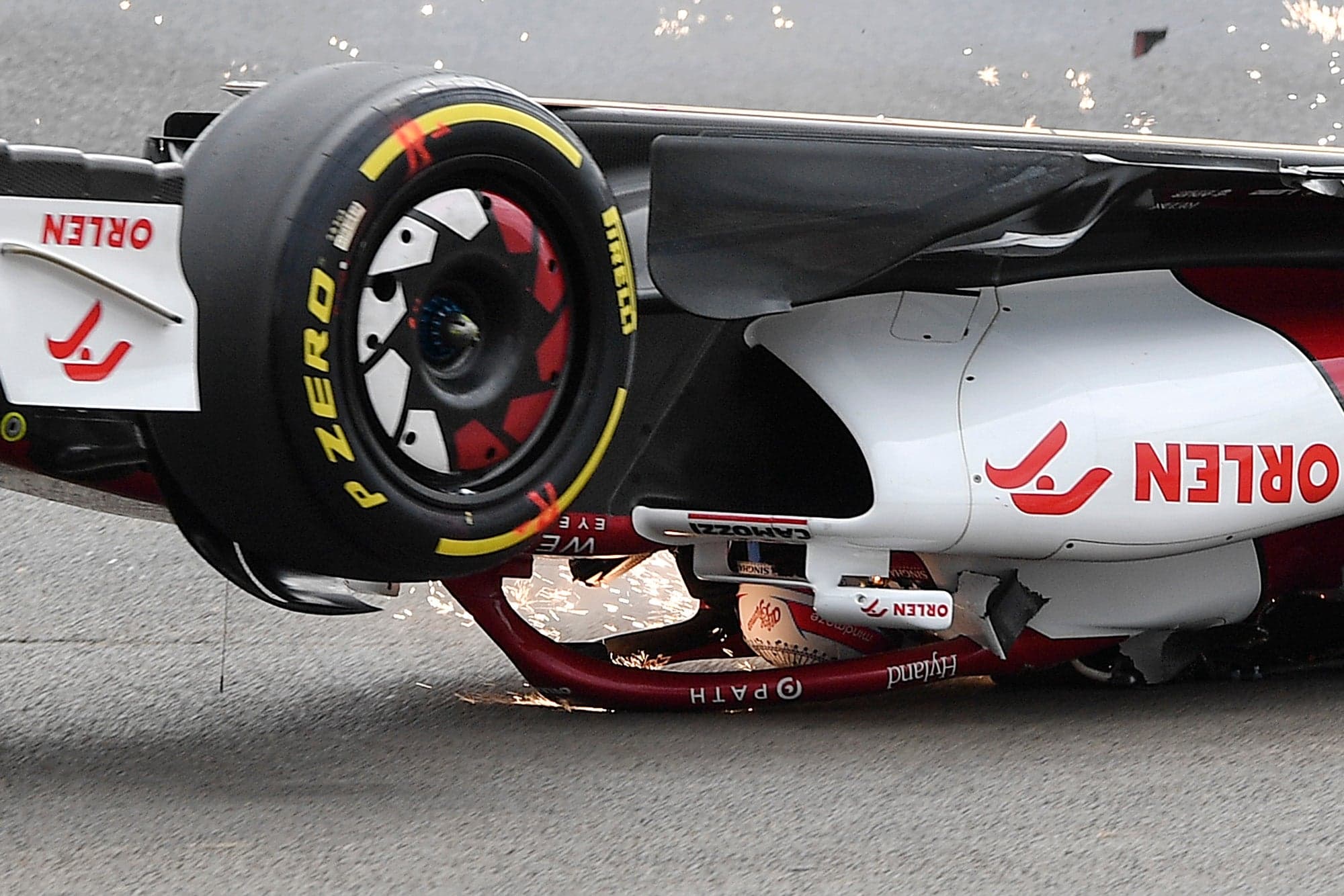 Zhou Guanyu's car sliding across the tarmac on the halo alone, the rear of the monocoque having collapsed