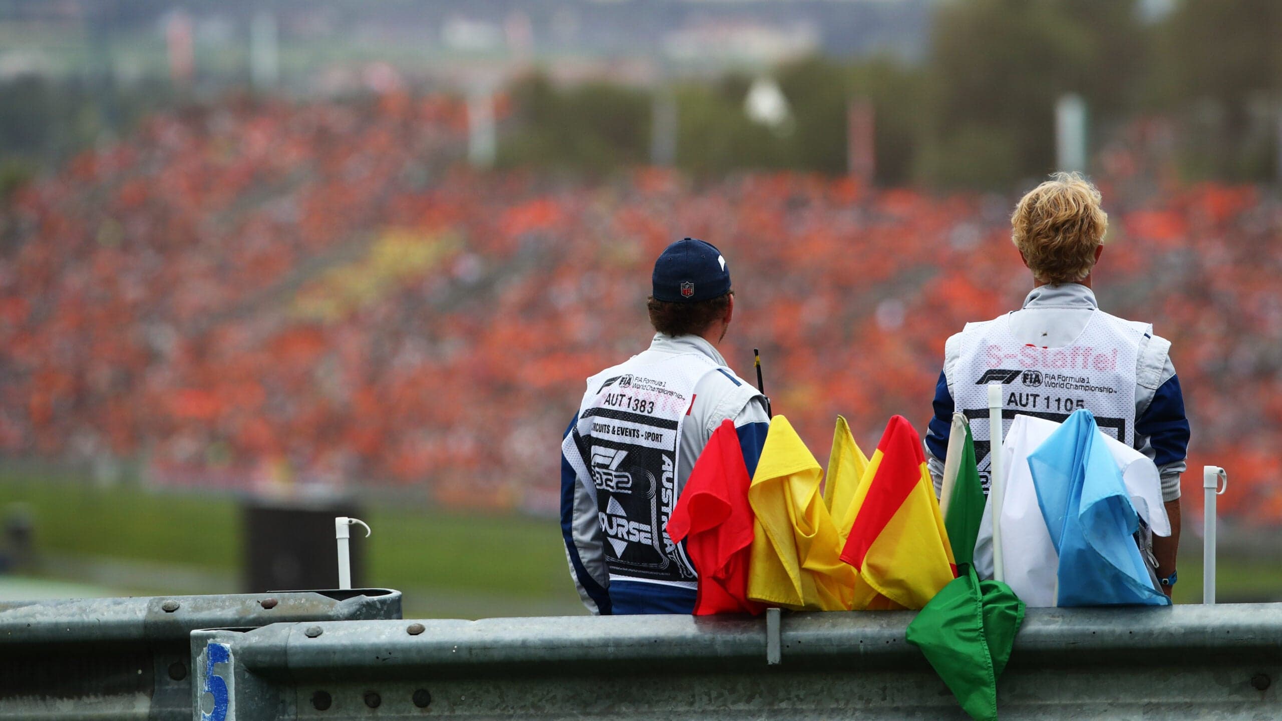 Marshals by the side of the track, with signalling flags, during the Austrian Grand Prix