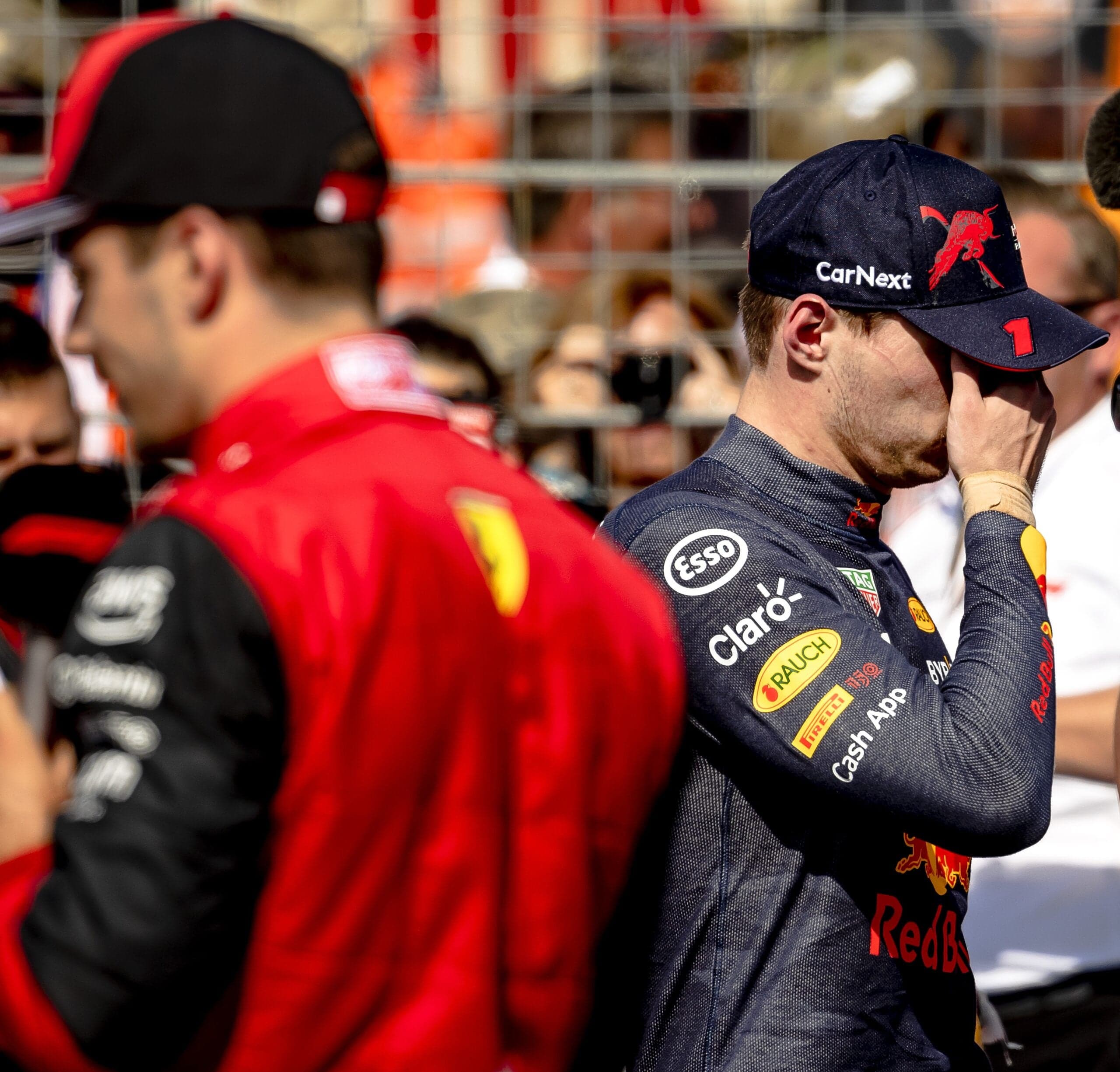 Charles Leclerc at the French Grand Prix, with Max Verstappen facepalming in the background