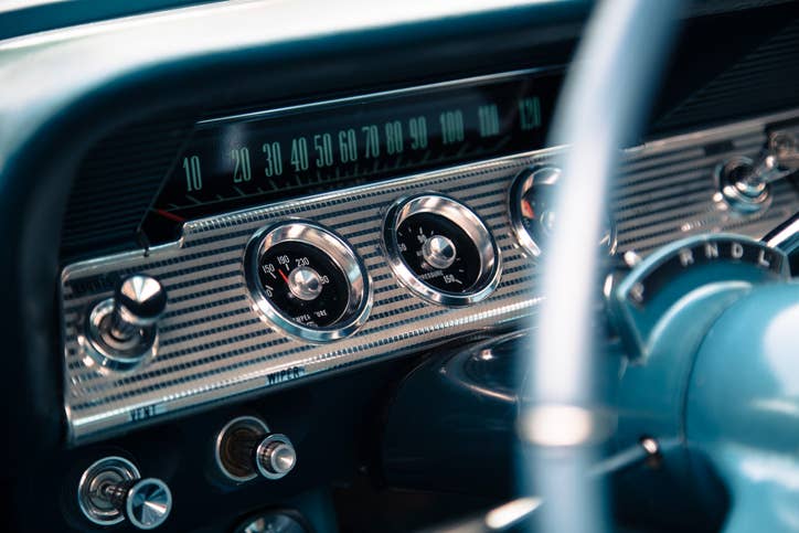 The dashboard of a classic car.