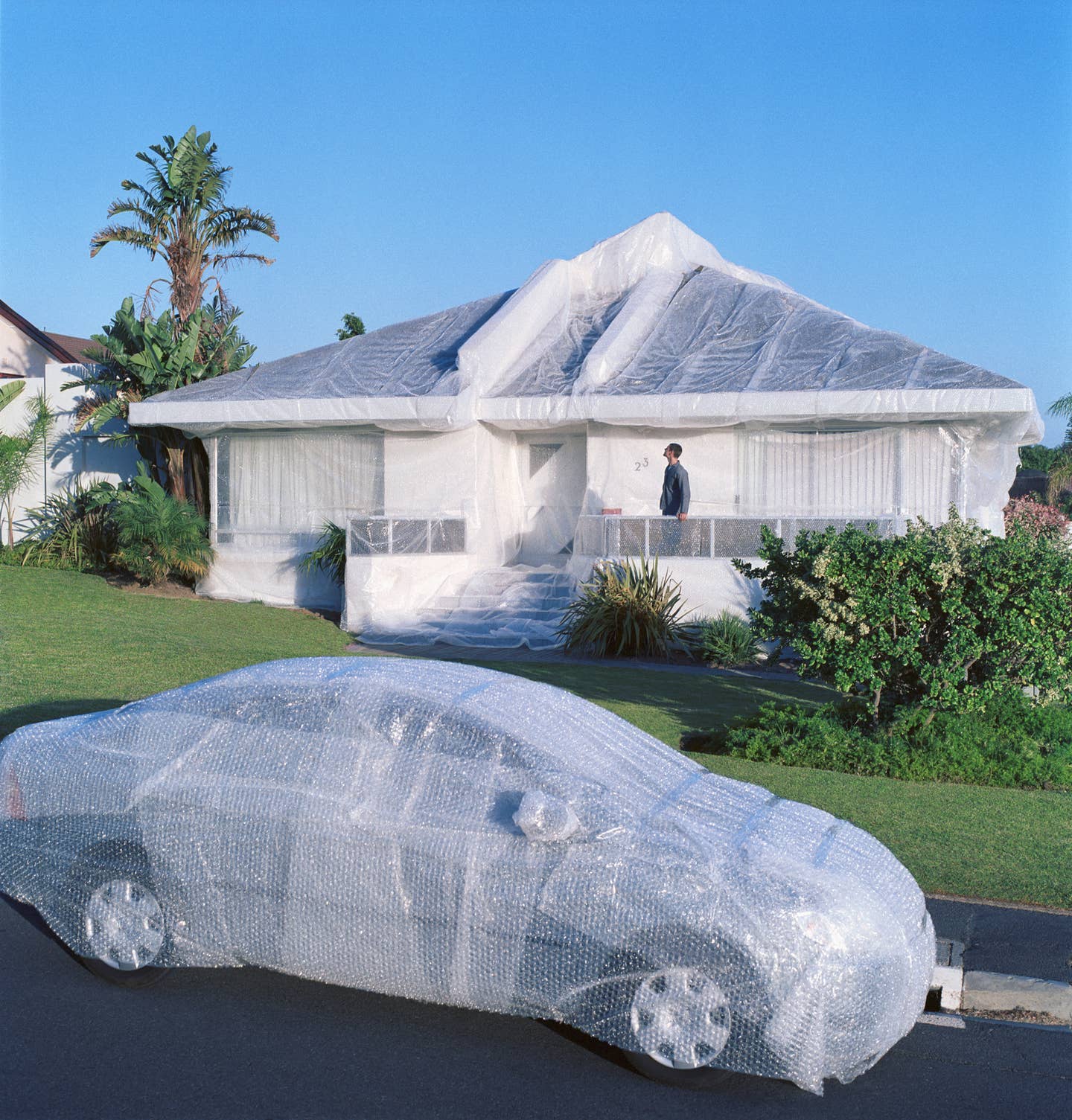 Bubble wrapped car and house.