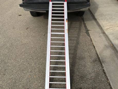An ATV ramp positioned on a truck.