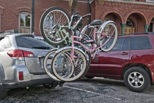 A car with a hitch bike rack and bikes attached