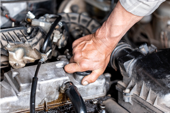 Auto mechanic repairs a car