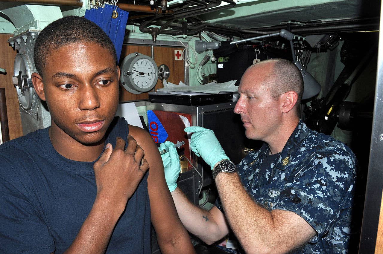 message-editor%2F1592256045697-1280px-us_navy_110915-n-di599-018_master_chief_hospital_corpsman_david_peterson_assigned_to_commander_submarine_group_subgru_7.jpg