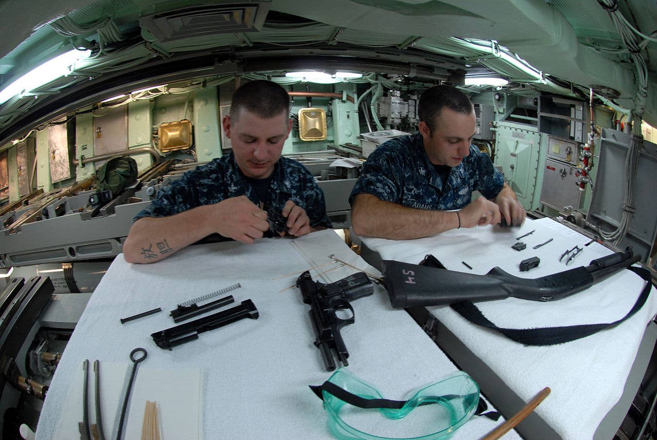 message-editor%2F1592257070453-1280px-us_navy_110621-n-nk458-140_sailors_conduct_maintenance_on_small_arms_in_the_torpedo_room_aboard_the_los_angeles-class_attack_submarine_uss_helena_.jpg