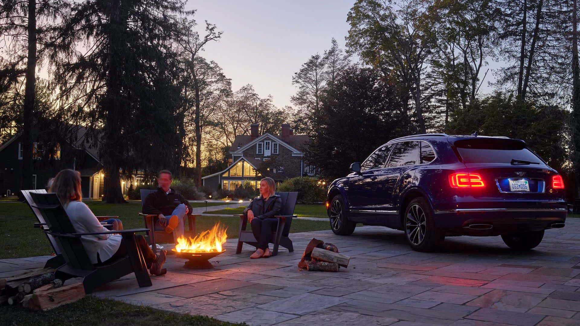 A Bentley Bentayga camping in the backyard.