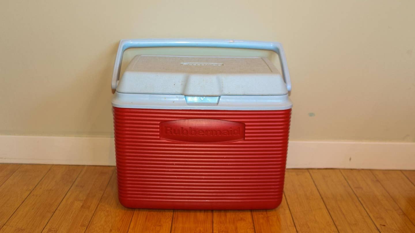 A red rubbermaid cooler.