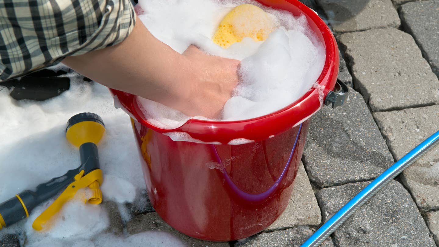 Use a two-bucket system when washing a car.
