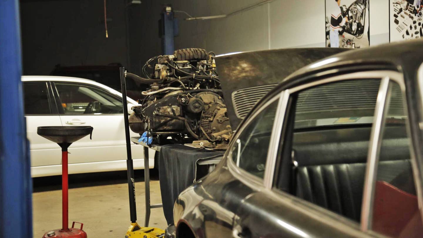 A Porsche engine removed from its bay by the author.