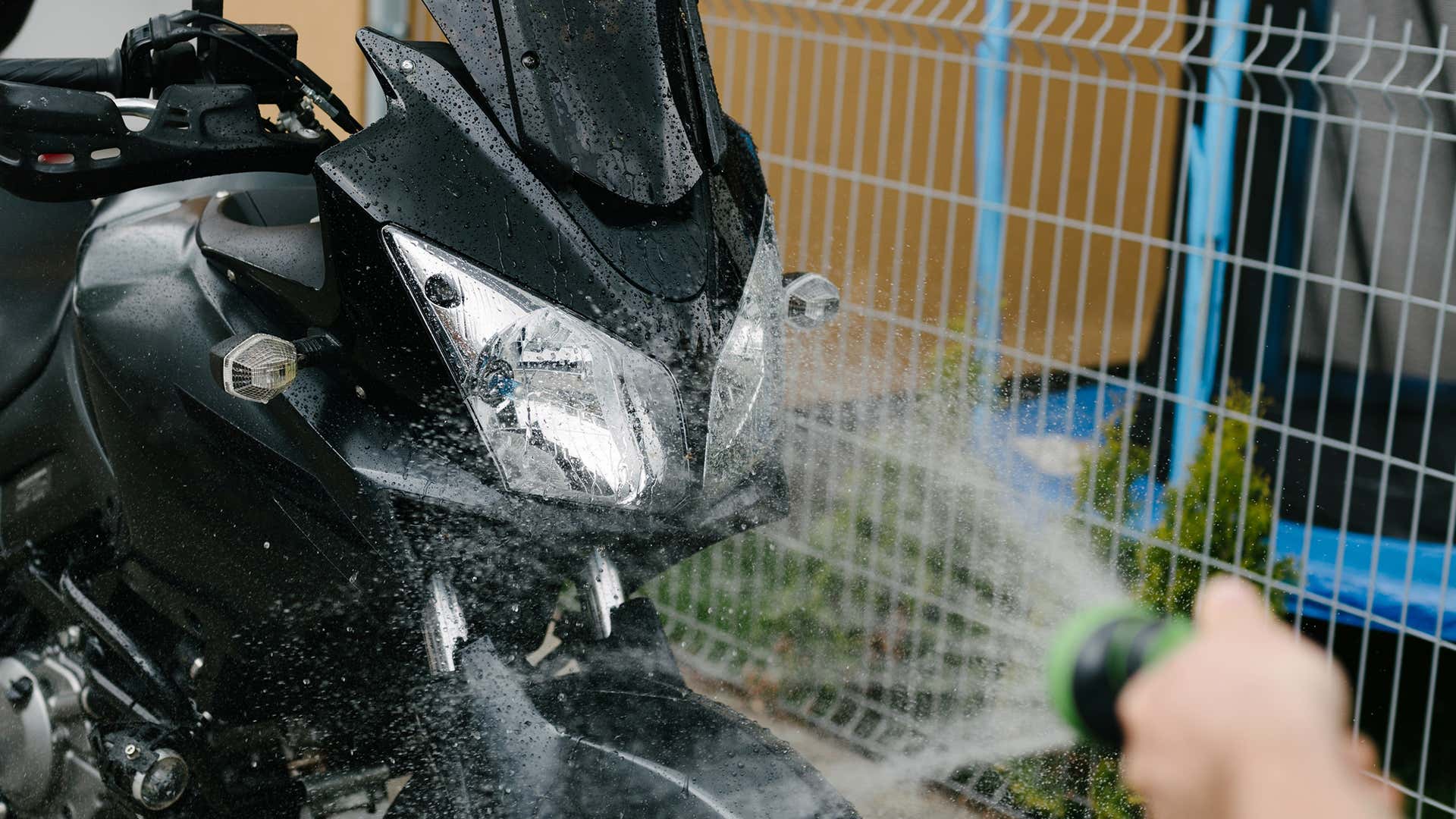 Be careful around seals and electronics when cleaning your motorcycle with a high-pressure water source.