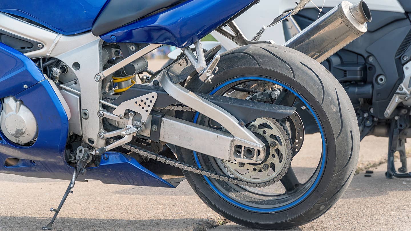 Prepare a clean and even space to clean your motorcycle chain.