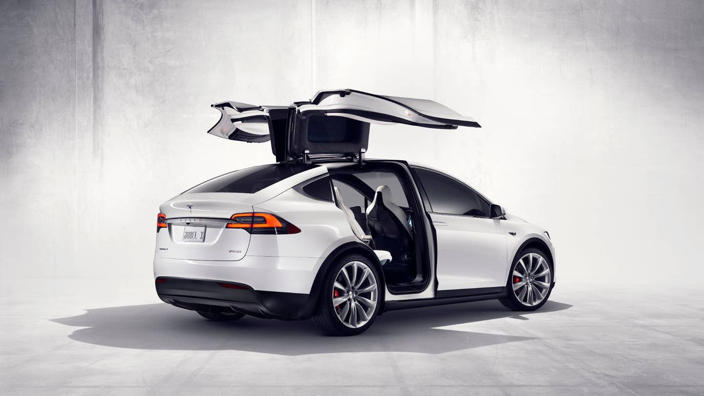 Tesla Model X with its falcon doors up.