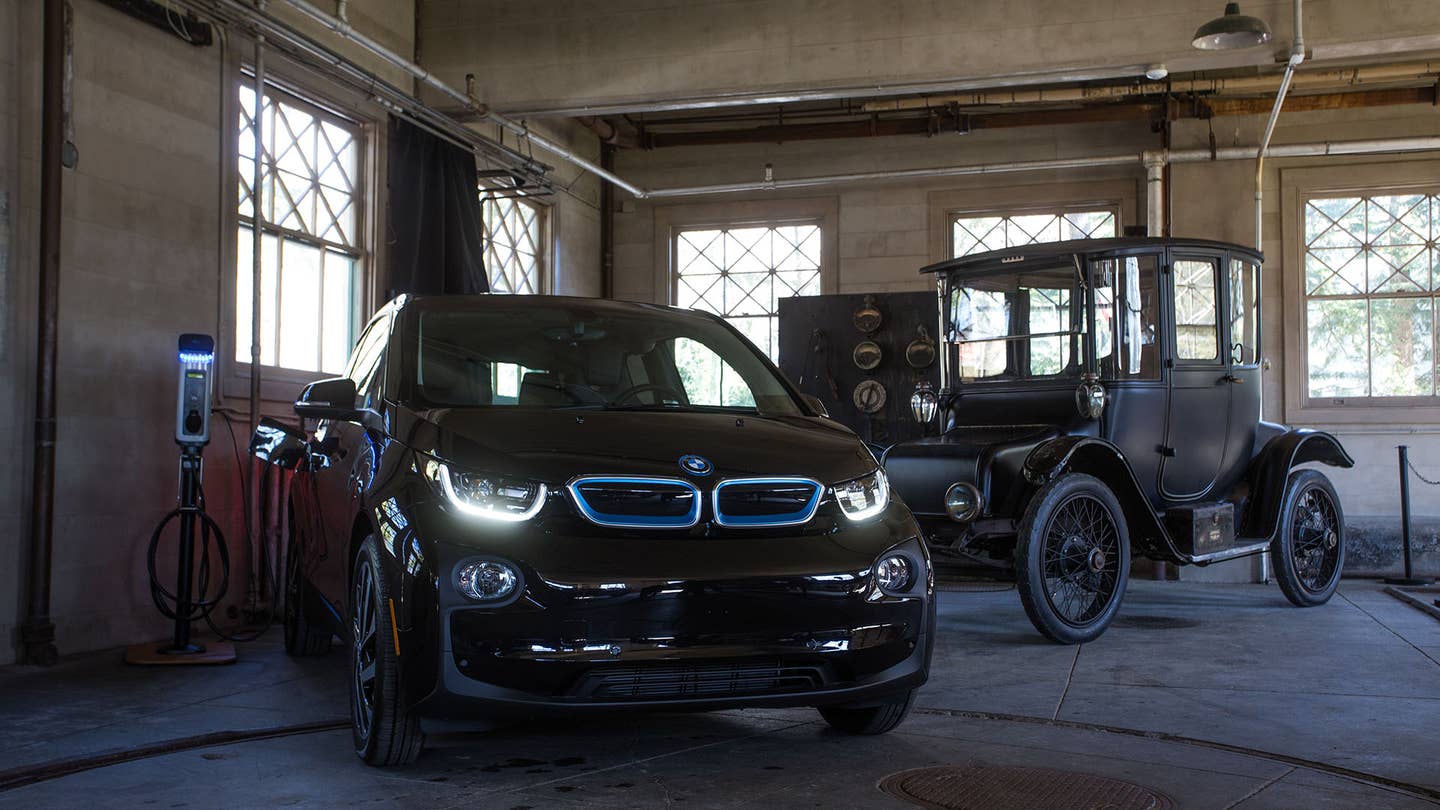 The BMW i3 poses next to a classic model.
