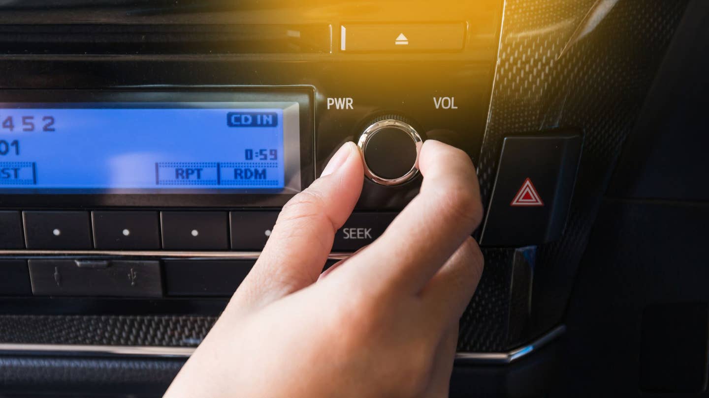 A volume knob on a car stereo.