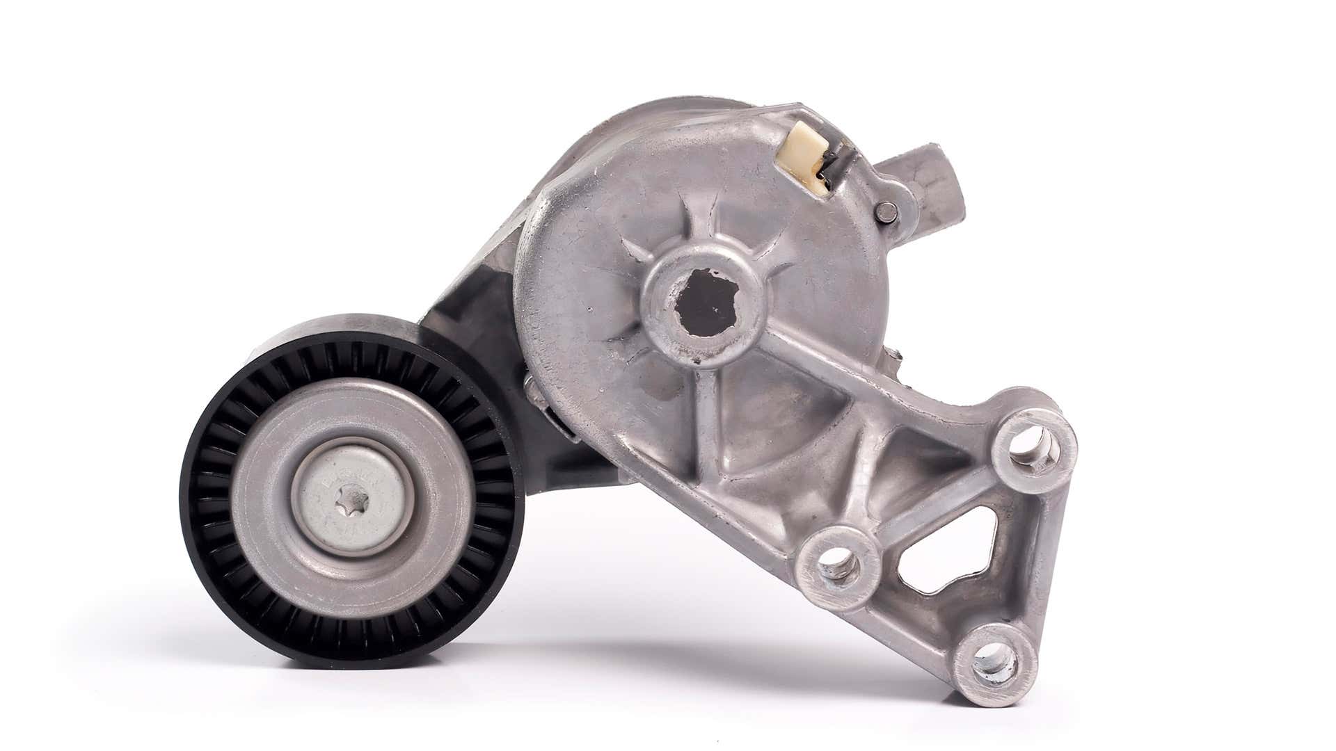 A belt tensioner off the engine on a white background.