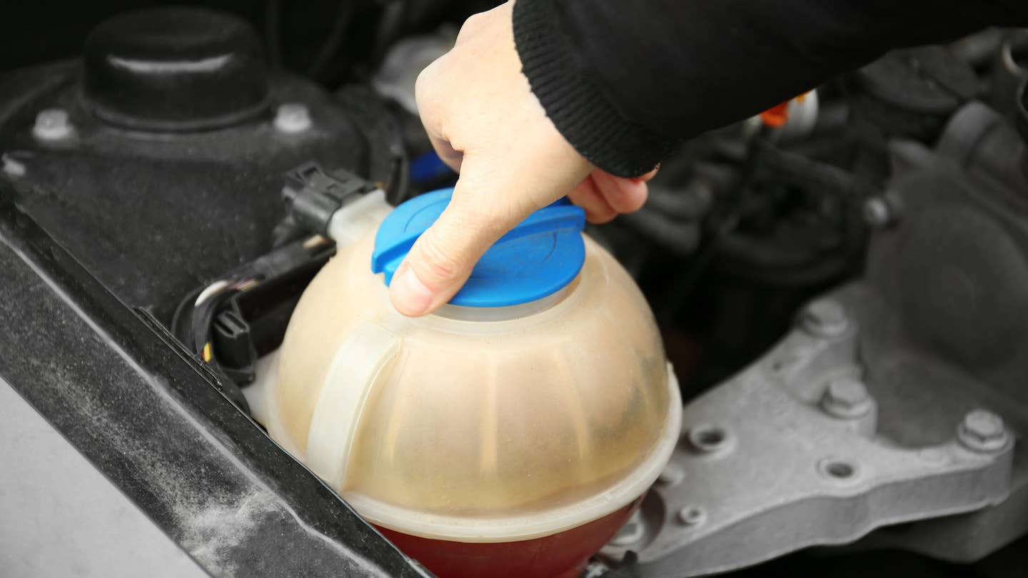 The coolant reservoir will look different depending on the vehicle.