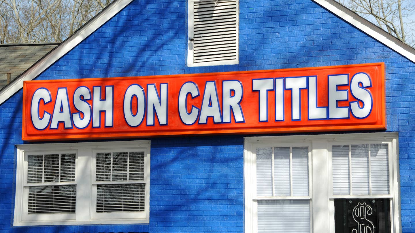 A business posts a sign offering cash on car titles.