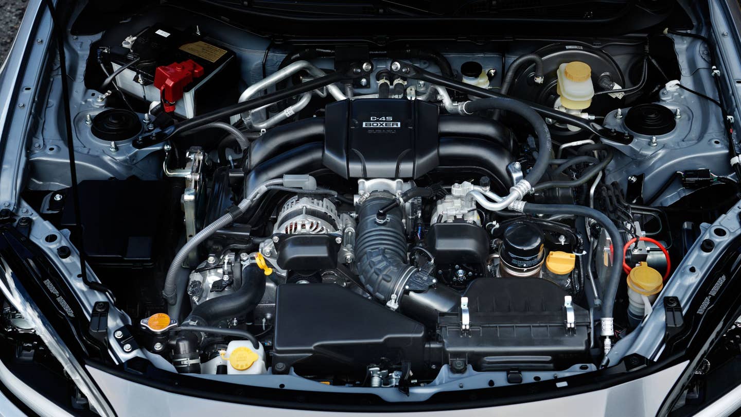 An overhead view shows the 2022 Subaru BRZ's boxer engine bay.