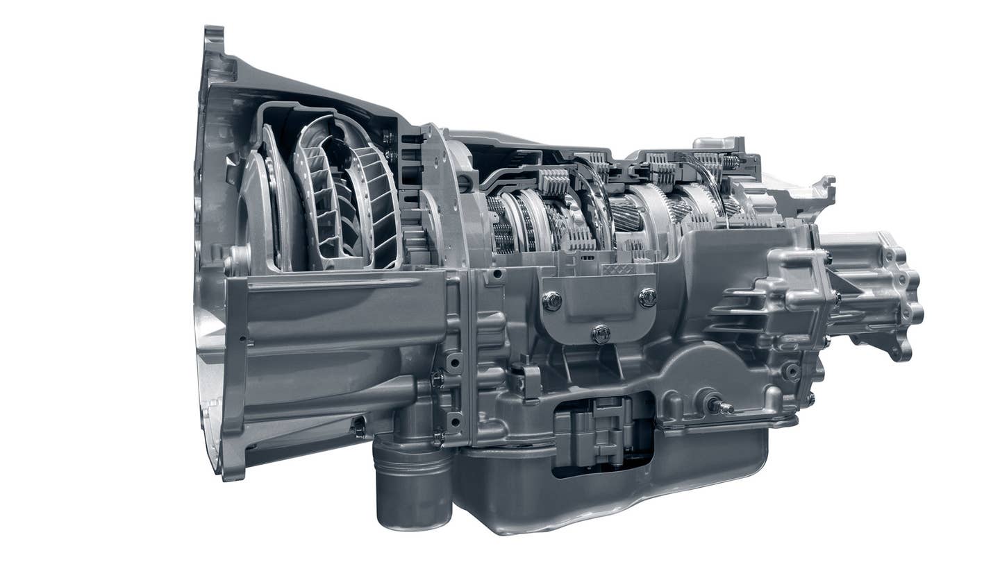 A cutout of an automatic transmission contrasts against a white background.