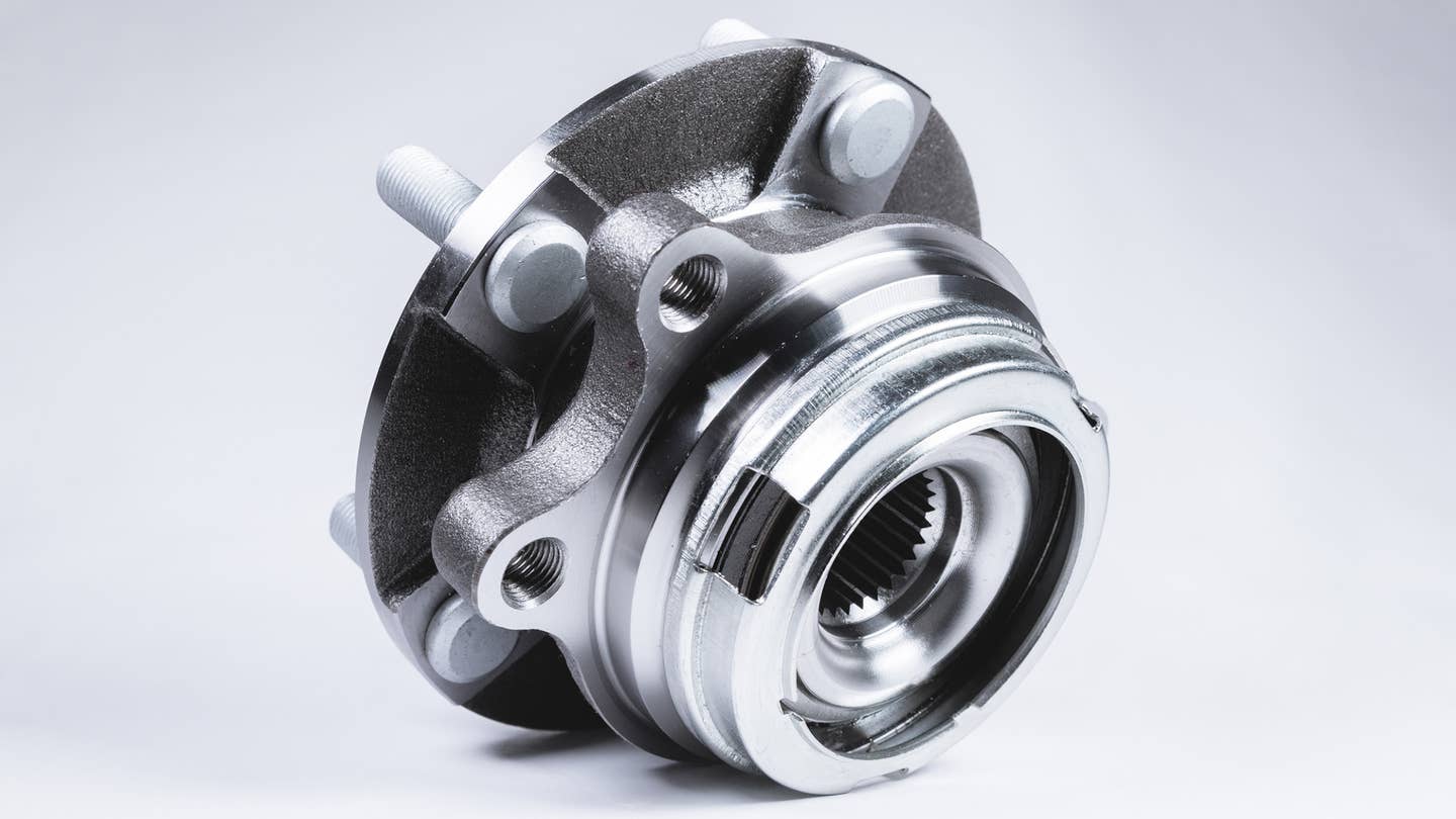 A wheel hub assembly on a gray background.