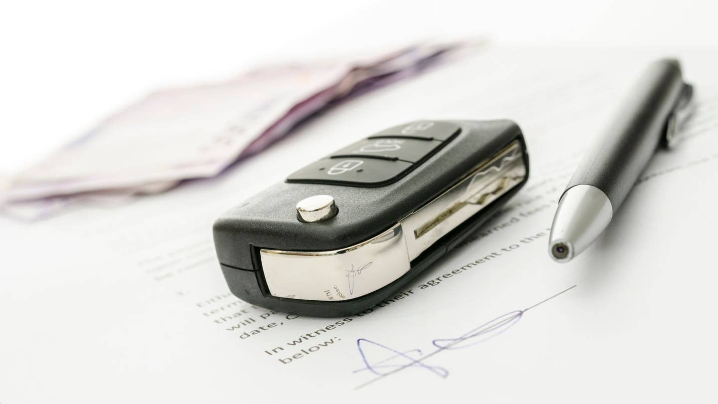 A car key and a donation contract. 