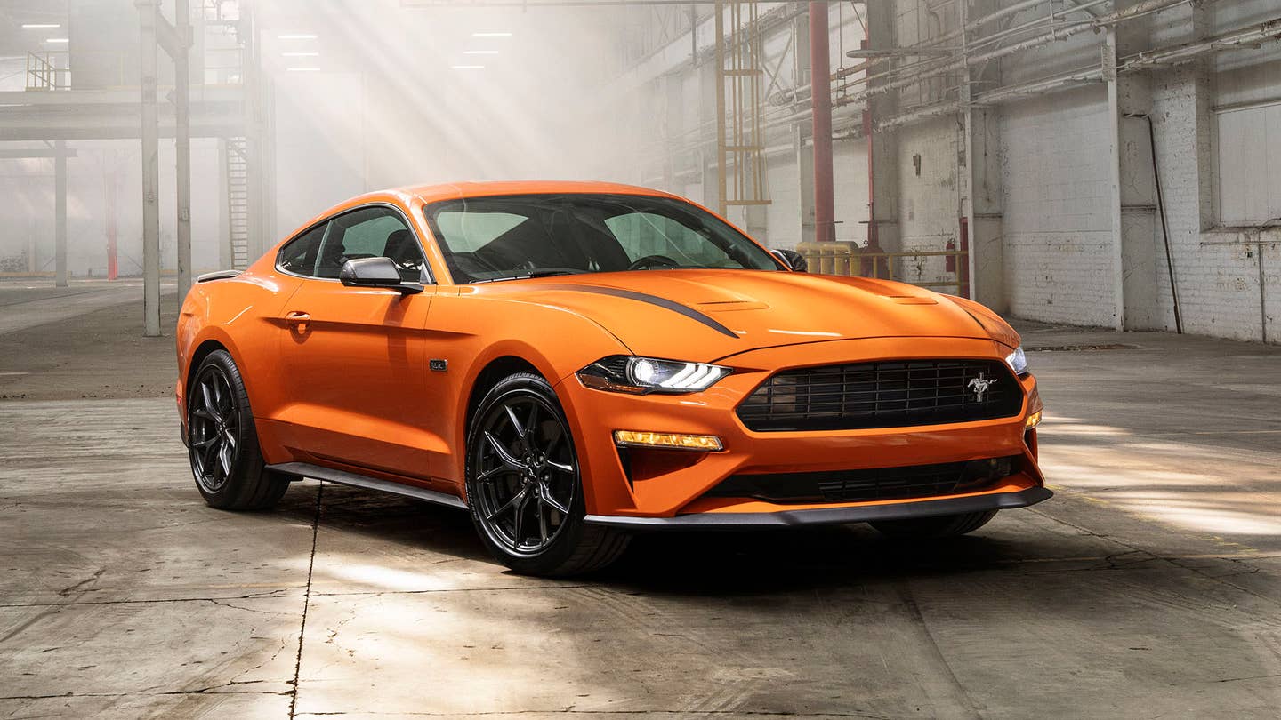 An orange EcoBoost Ford Mustang HPP in a warehouse.