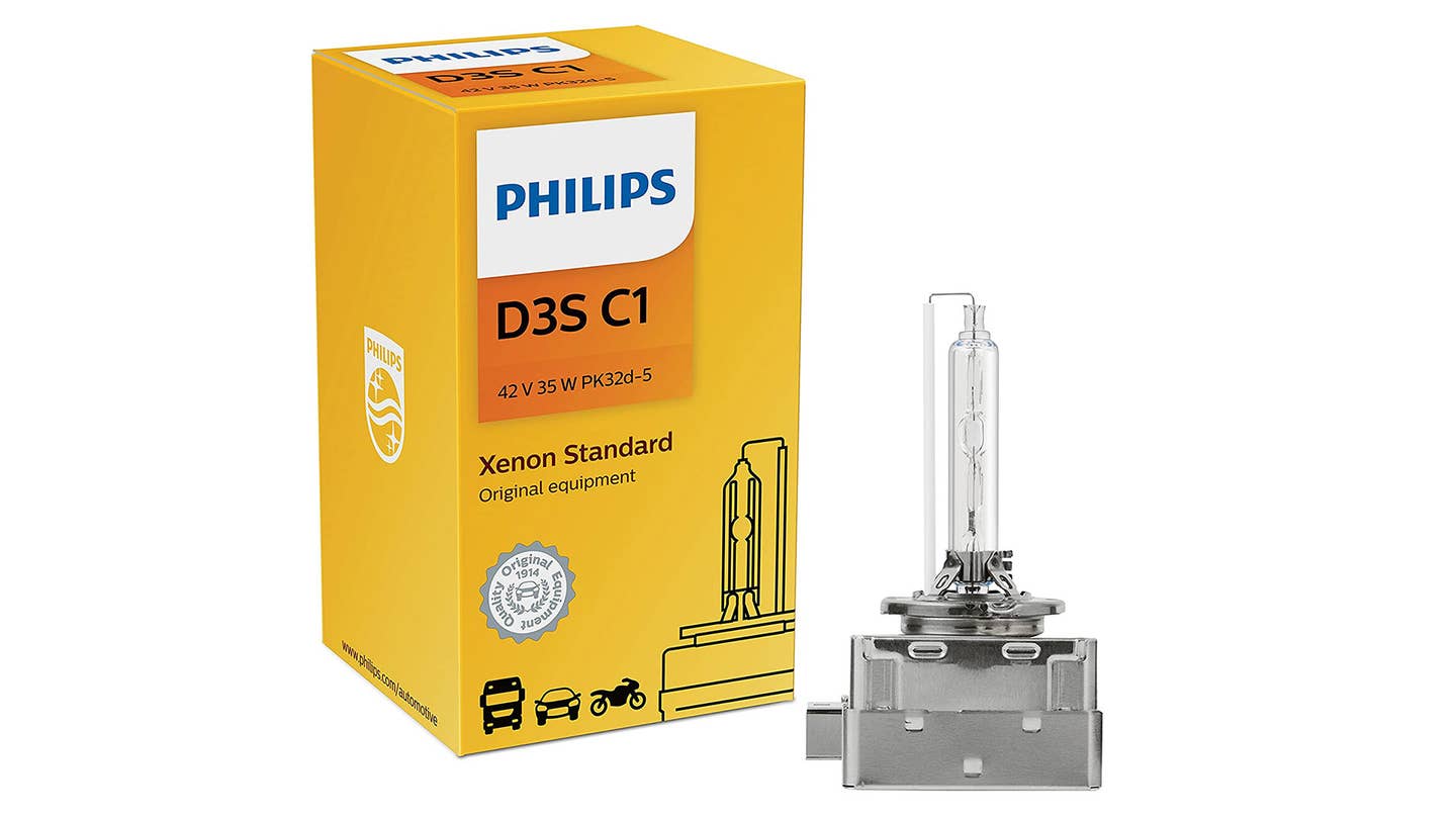 A Philips HID bulb and its yellow box on a white background.