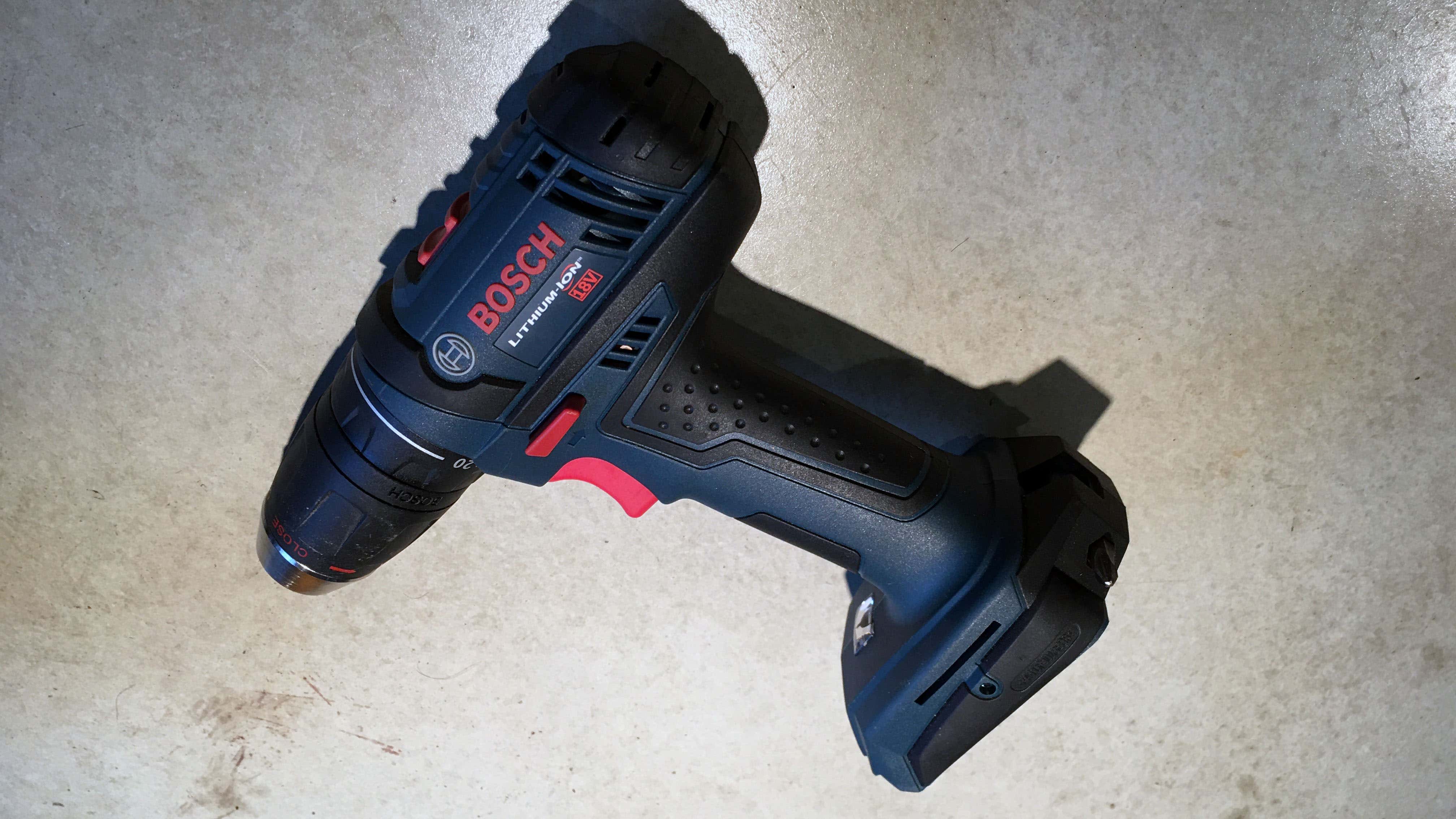 A Bosch lithium-ion cordless drill on a concrete counter.