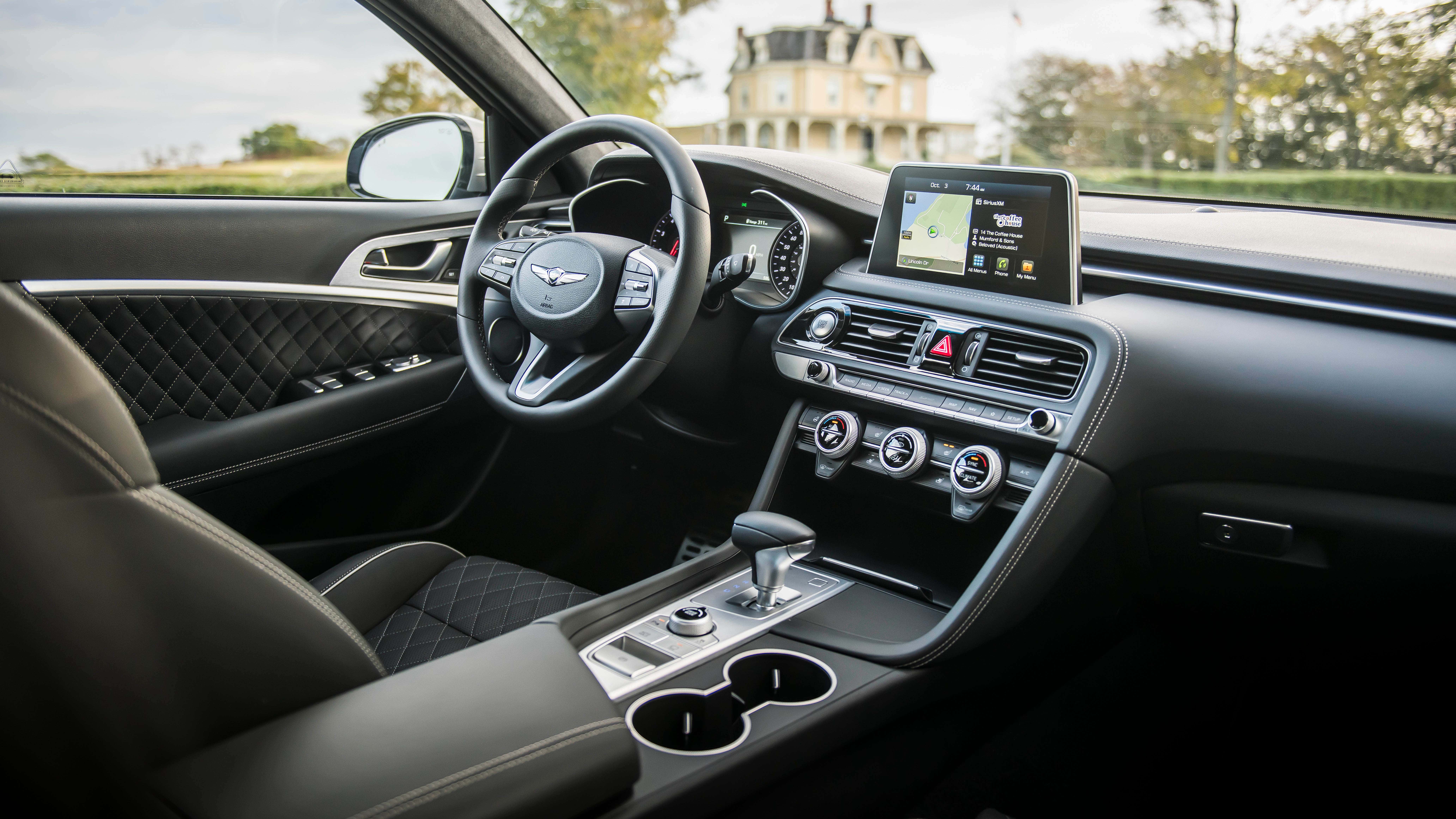 A quilted interior of a Genesis G70.