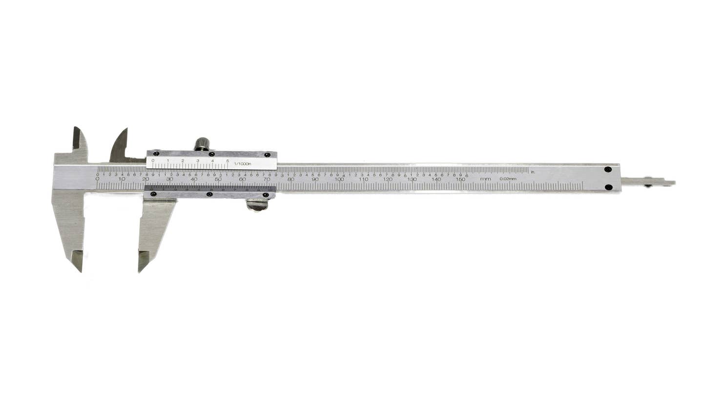 A metal caliper tool on a white background.
