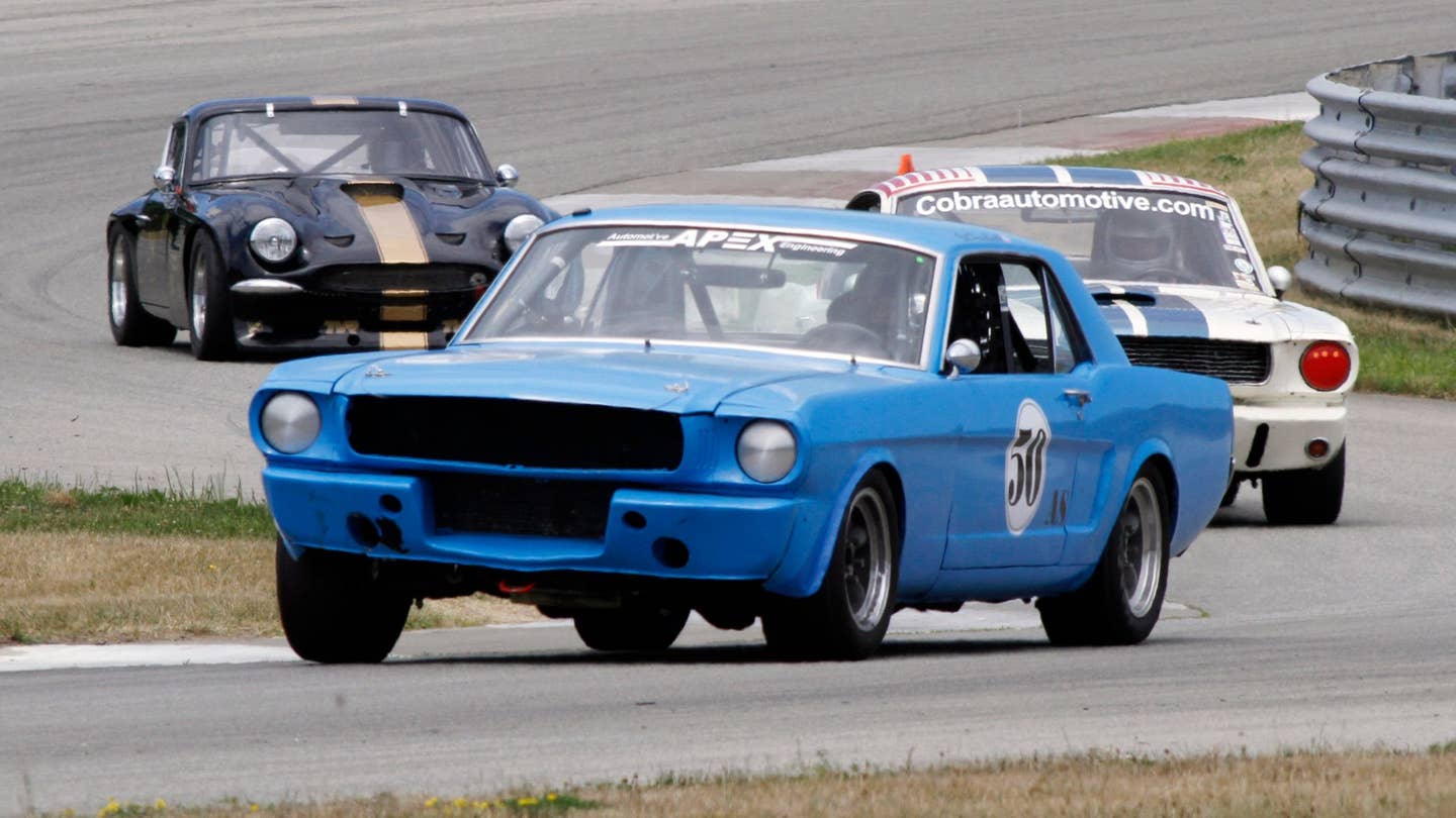 A set of Mustangs on track. 