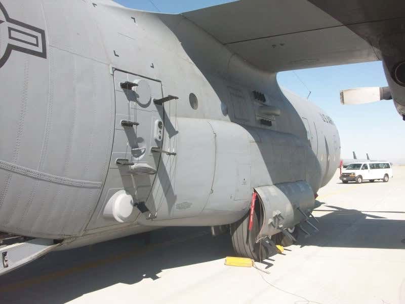 VIA THINKDEFENCE.CO.UK. A C-130 aircraft fitted with the Senior Scout signals intelligence package. Some of the antennas seen here fitted to the modified paratrooper door are similar to the ones seen underneath N27557's fuselage.