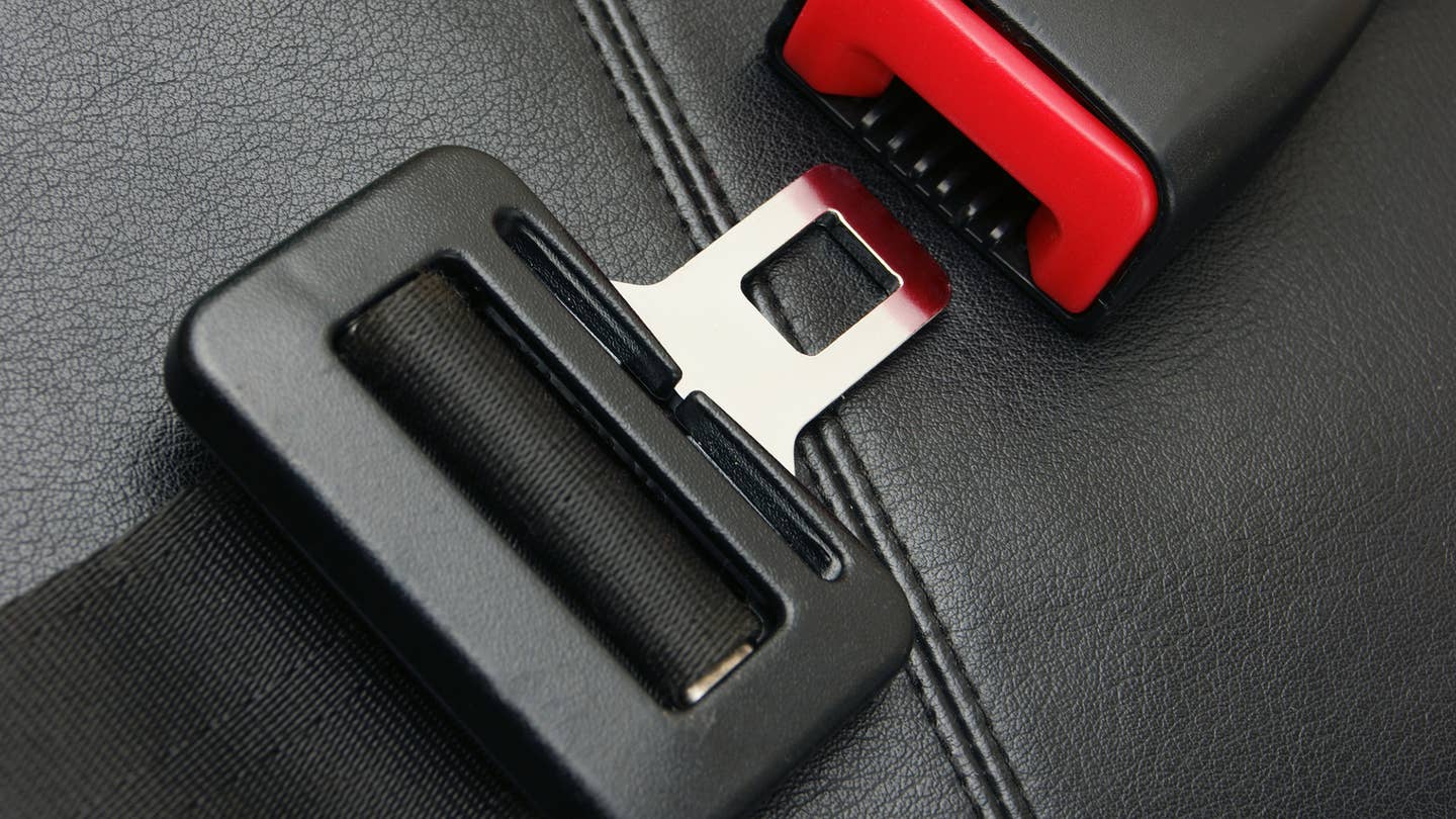 A close-up of a seat belt buckle.