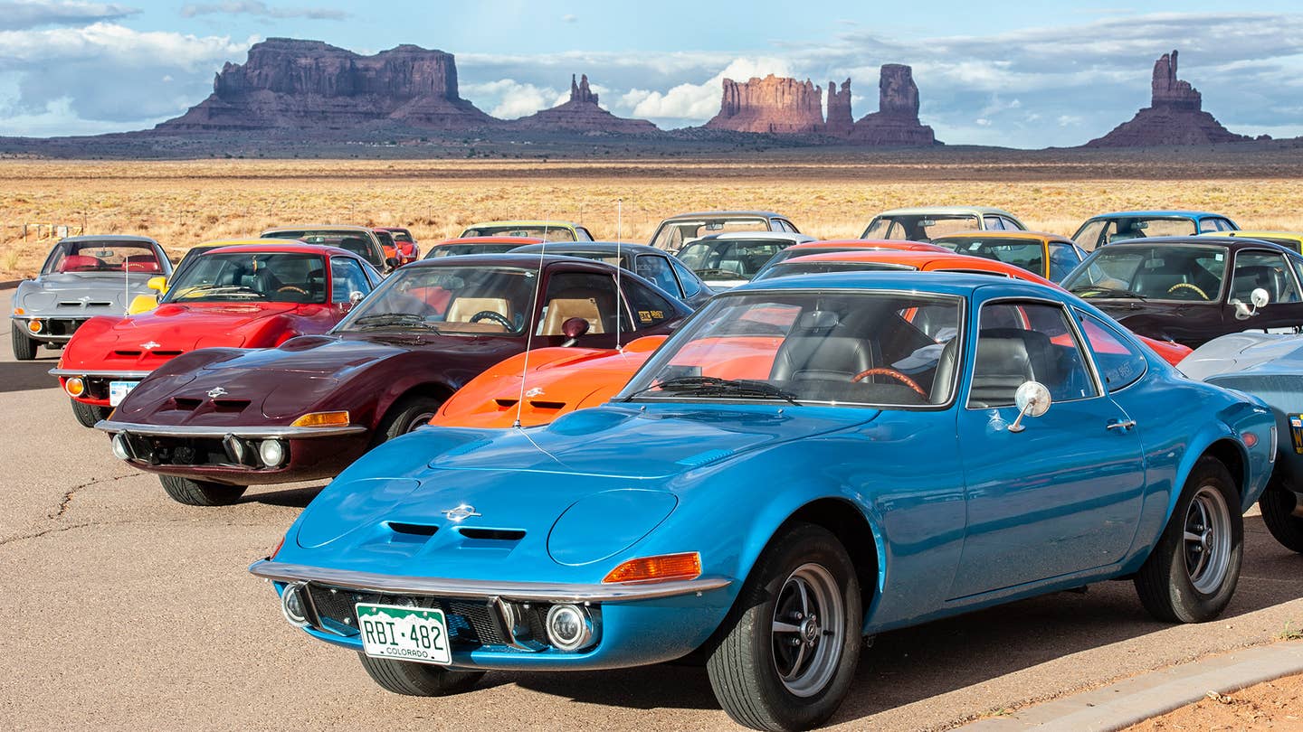 A gathering of colorful Opel GTs in the desert.